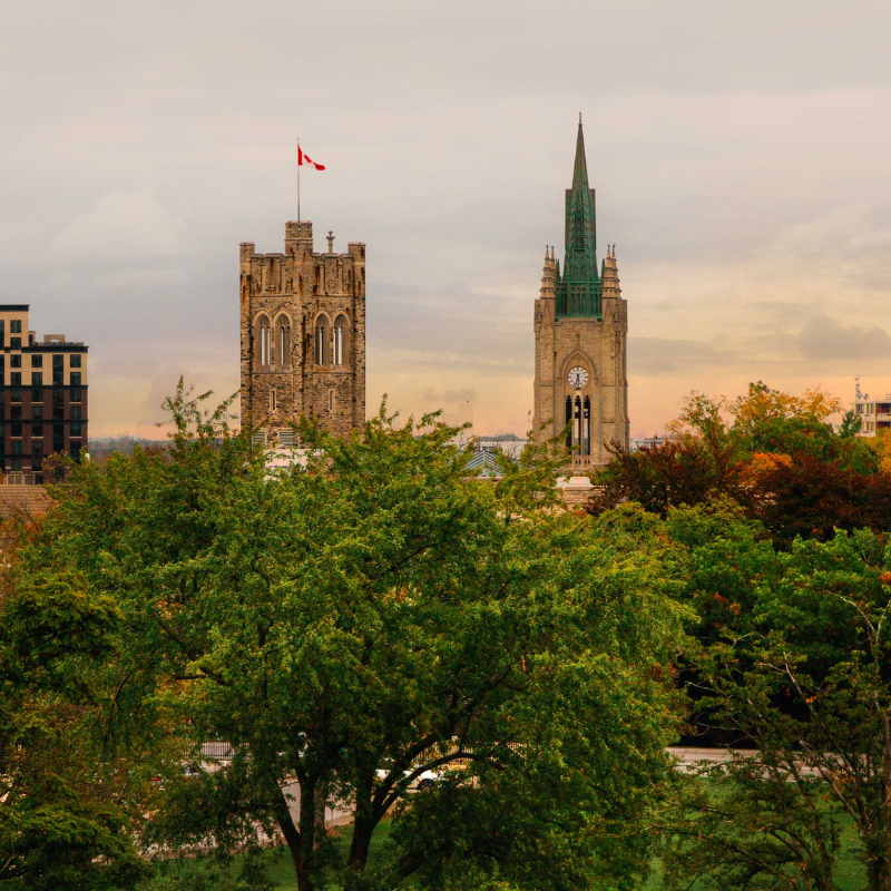 A young lady stands in front of the career services office.