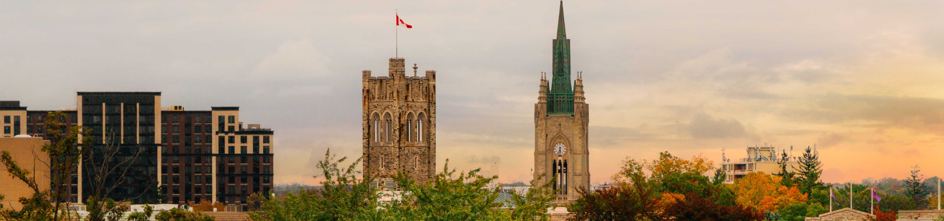 A young lady stands in front of the career services office.